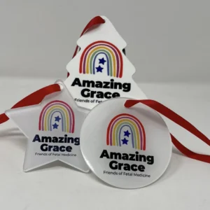 Flat plastic Amazing Grace Christmas decorations (tree, star, bauble) with logo and “Amazing Grace Friends of Fetal Medicine,” hanging with red ribbons